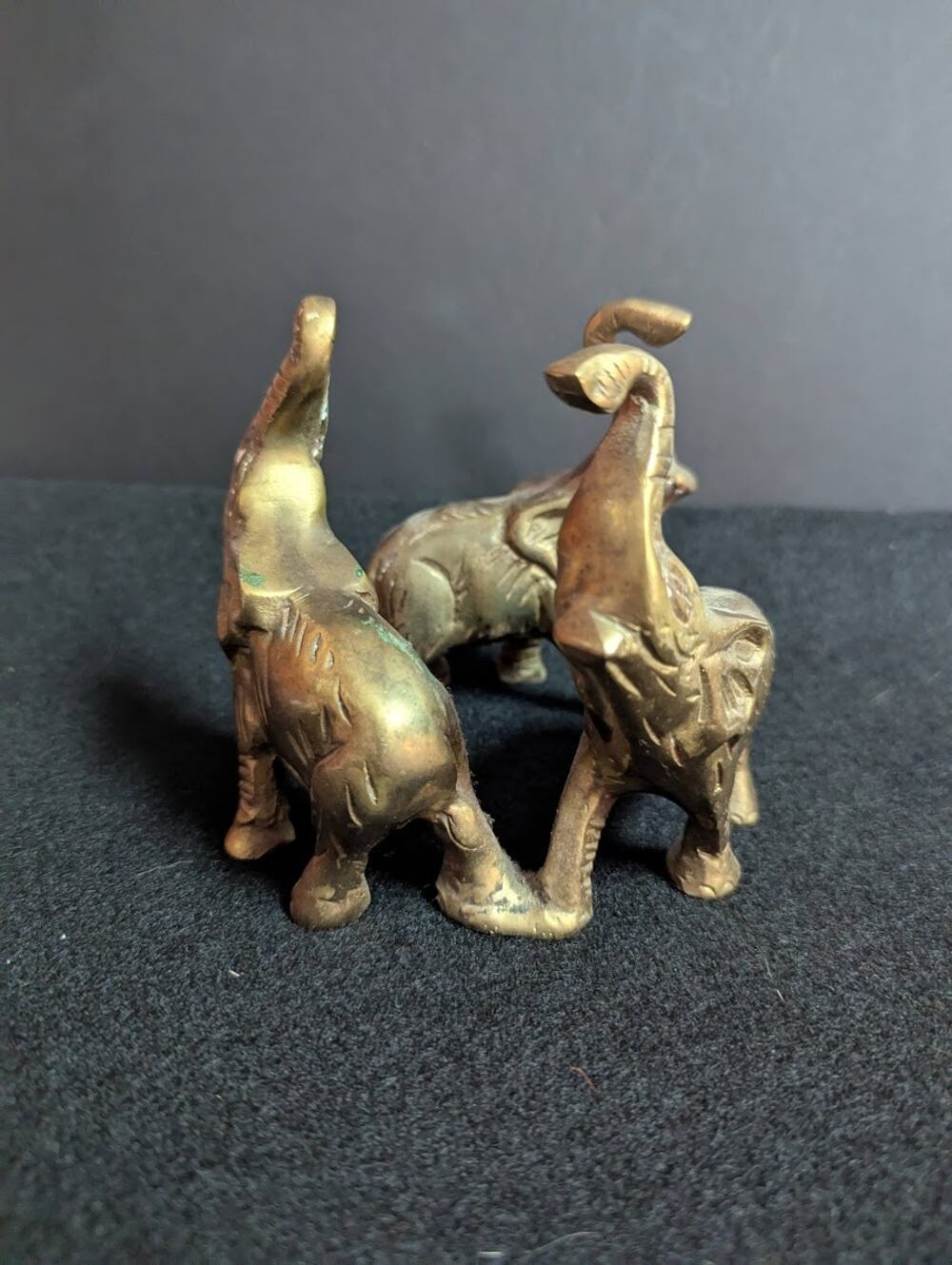 Small vintage bronze ring of 3 elephants trunks raised all attached